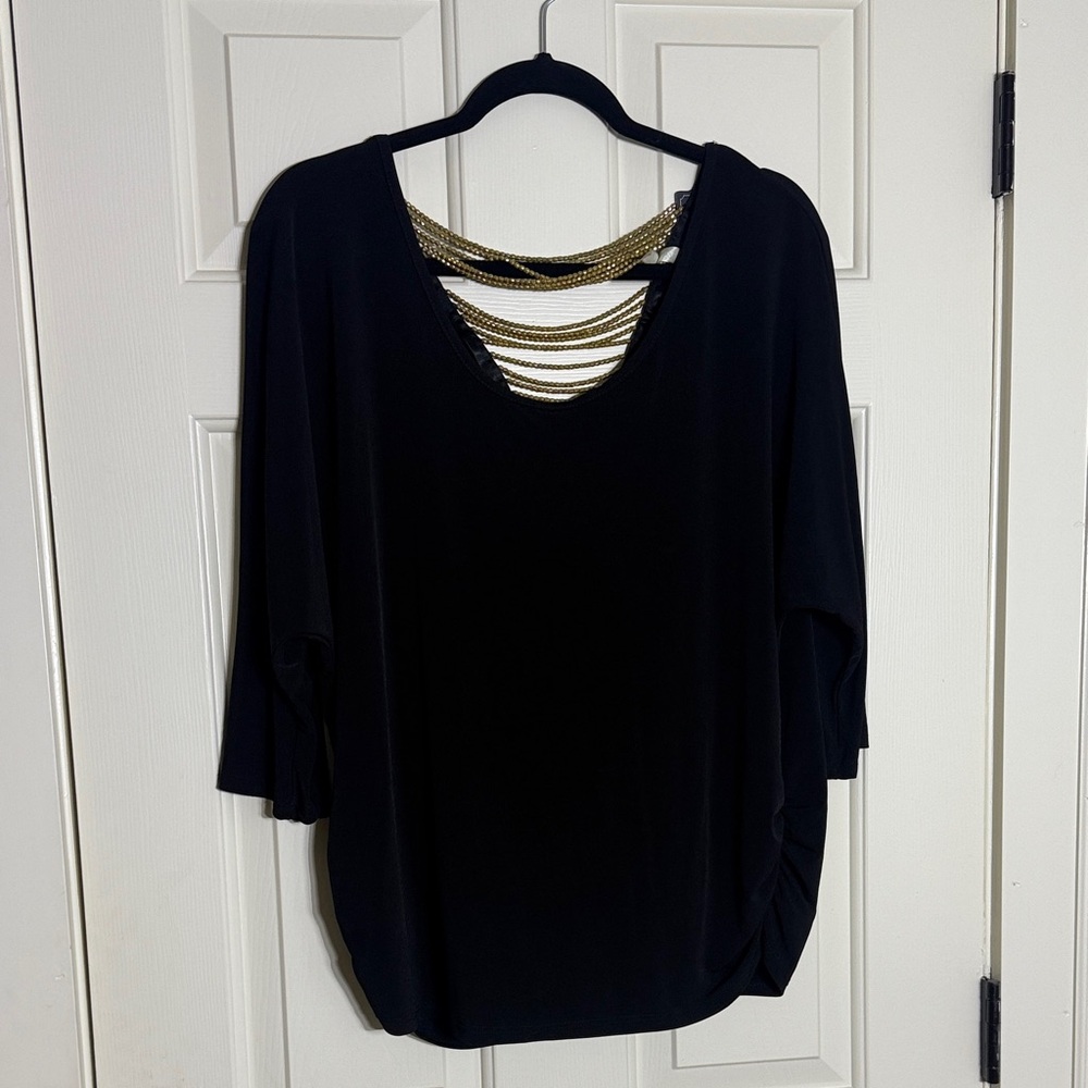 Elegant Black Top with Gold Accents